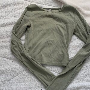 This is a green plain long sleeve from garage selling for 10$
